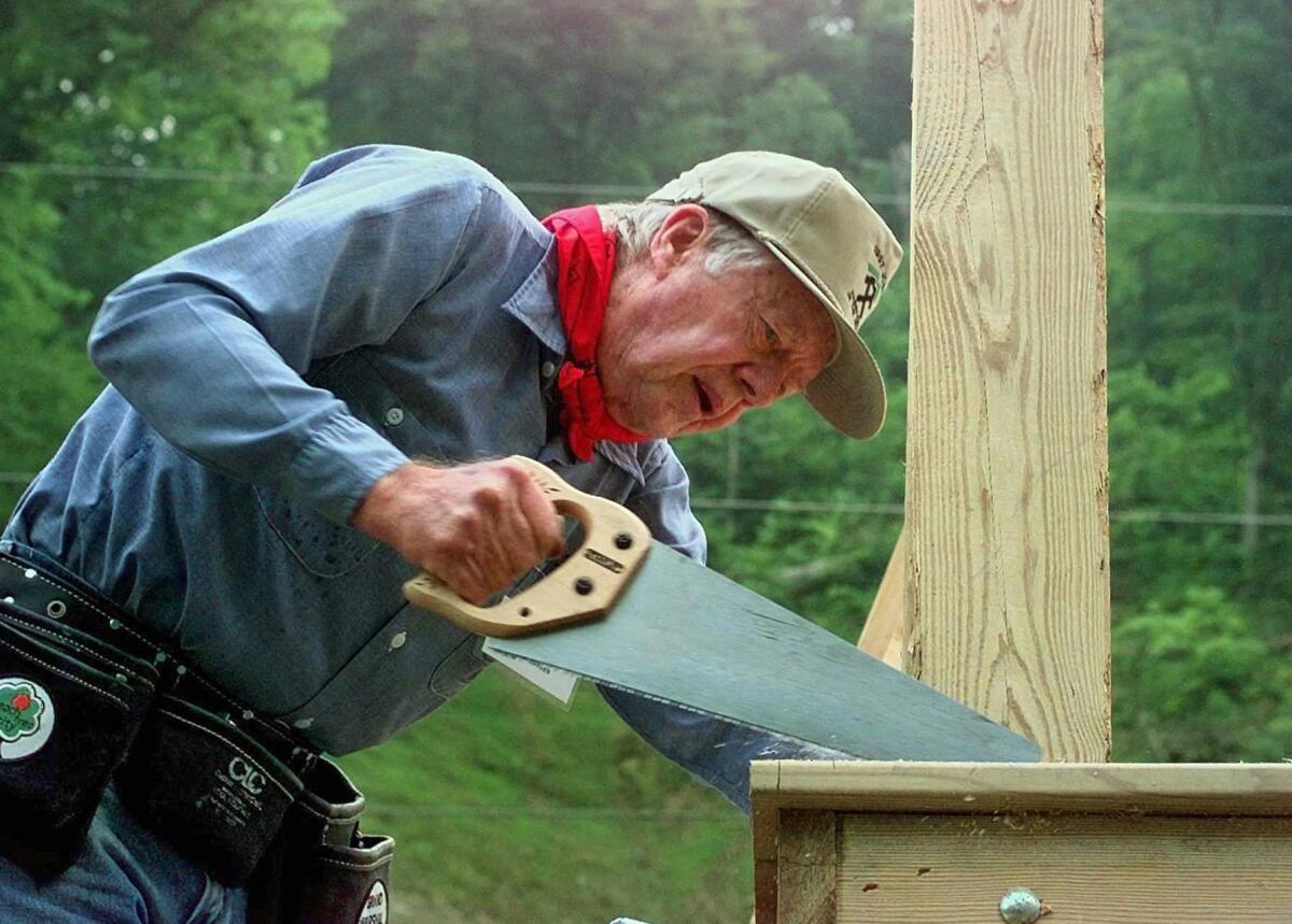 Former President Carter works on a Habitat for Humanity home in Pikeville, Ky., 1997. On Wednesday, Carter announced he has cancer and will undergo treatment at an Atlanta hospital.
