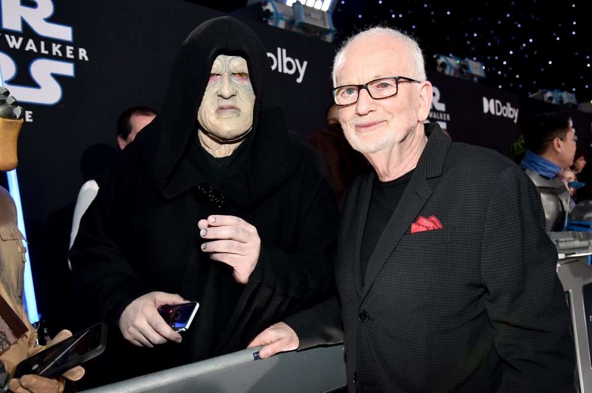 Ian McDiarmid poses with a Palpatine cosplayer at 'The Rise of Skywalker' world premiere