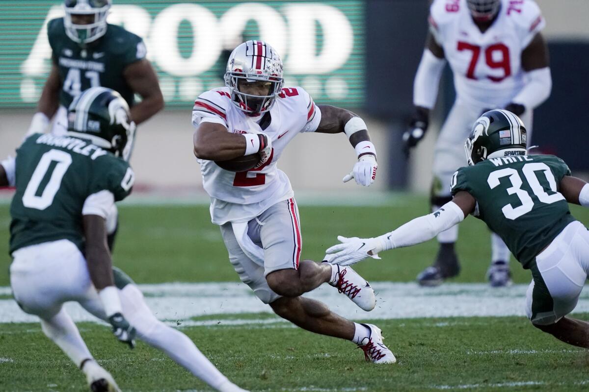 Ohio State wide receiver Emeka Egbuka carries the ball against Michigan State on Oct. 8.