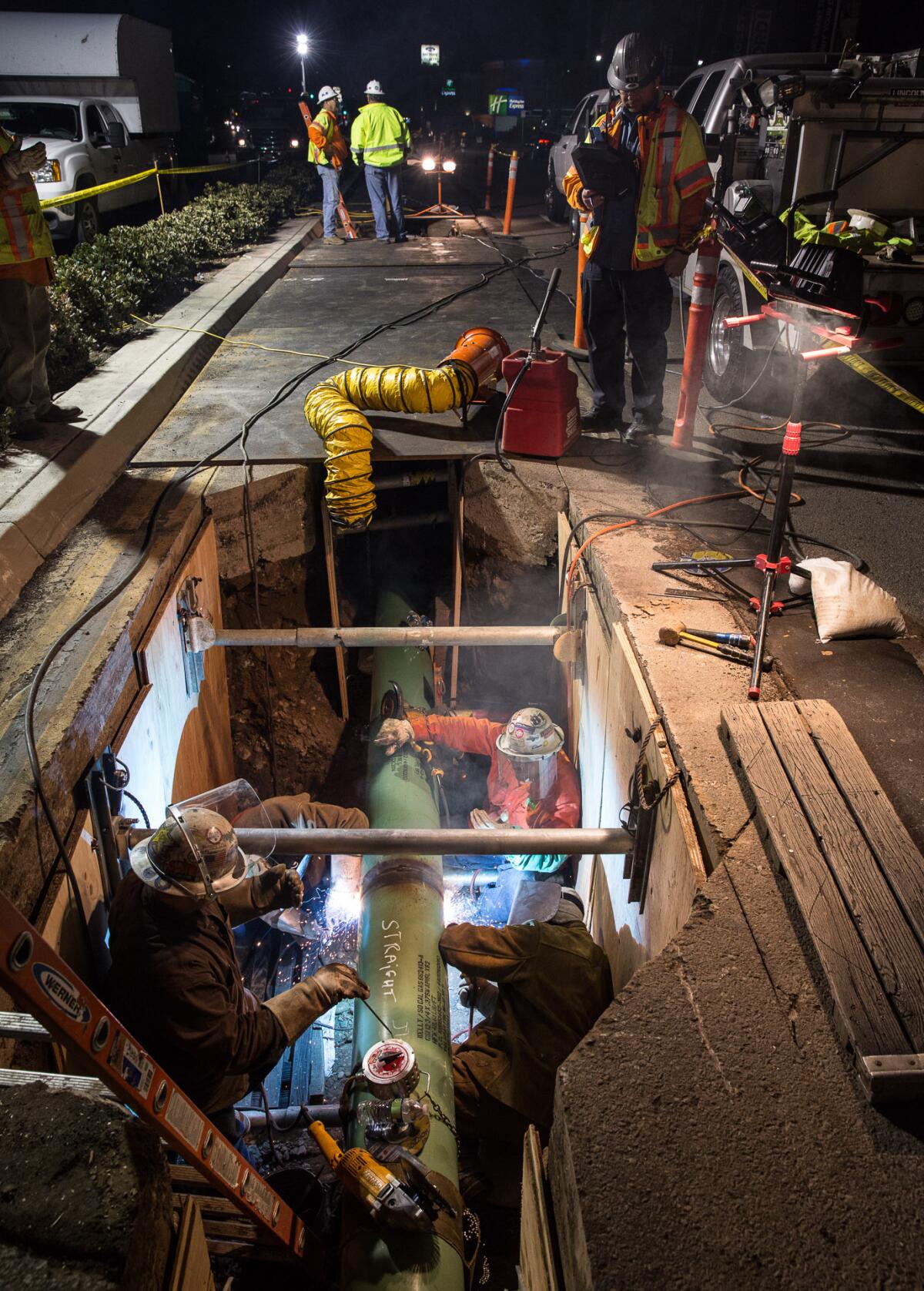 A crew works on a San Diego Gas & Electric natural gas pipeline in Pacific Beach. 
