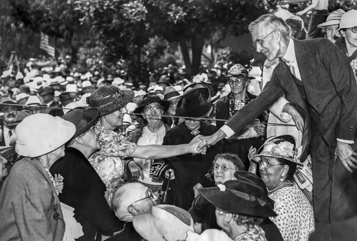 June 23, 1938: Dr. Francis Townsend shakes hands with followers at the third national convention of the Townsend Pension Plan at Bixby Park in Long Beach. About 6,000 delegates attended the convention.