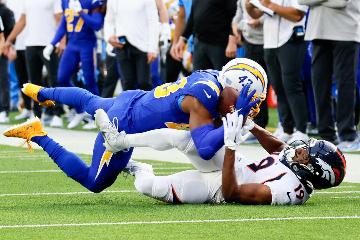 Chargers cornerback Michael Davis intercepts a pass intended for Denver Broncos wide receiver Marvin Mims Jr.