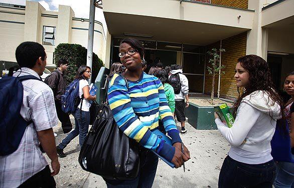 Jefferson High School student Khadijah Williams, 18, looks for friends to sign her yearbook. Williams has been homeless her whole life but through hard work and perseverance, she was accepted to Harvard University in the fall.