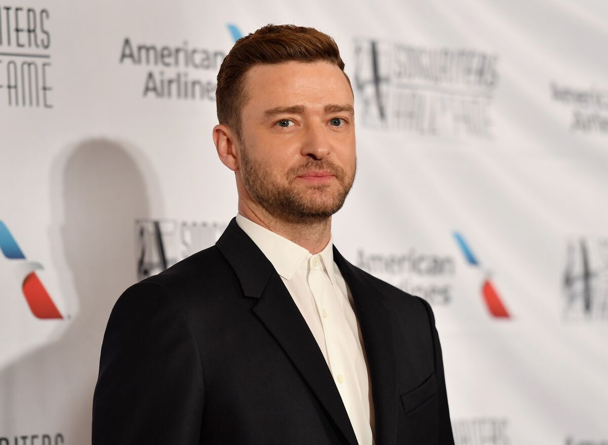 Justin Timberlake is apologizing to his family for a drunken night out with his "Palmer" costar.