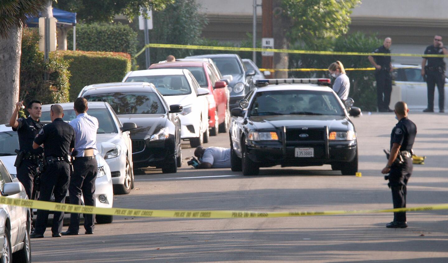 Glendale police investigate the scene where a man was found shot to death on a front yard on the 1600 block of The Midway St. in Glendale on Saturday morning, June 25, 2016.