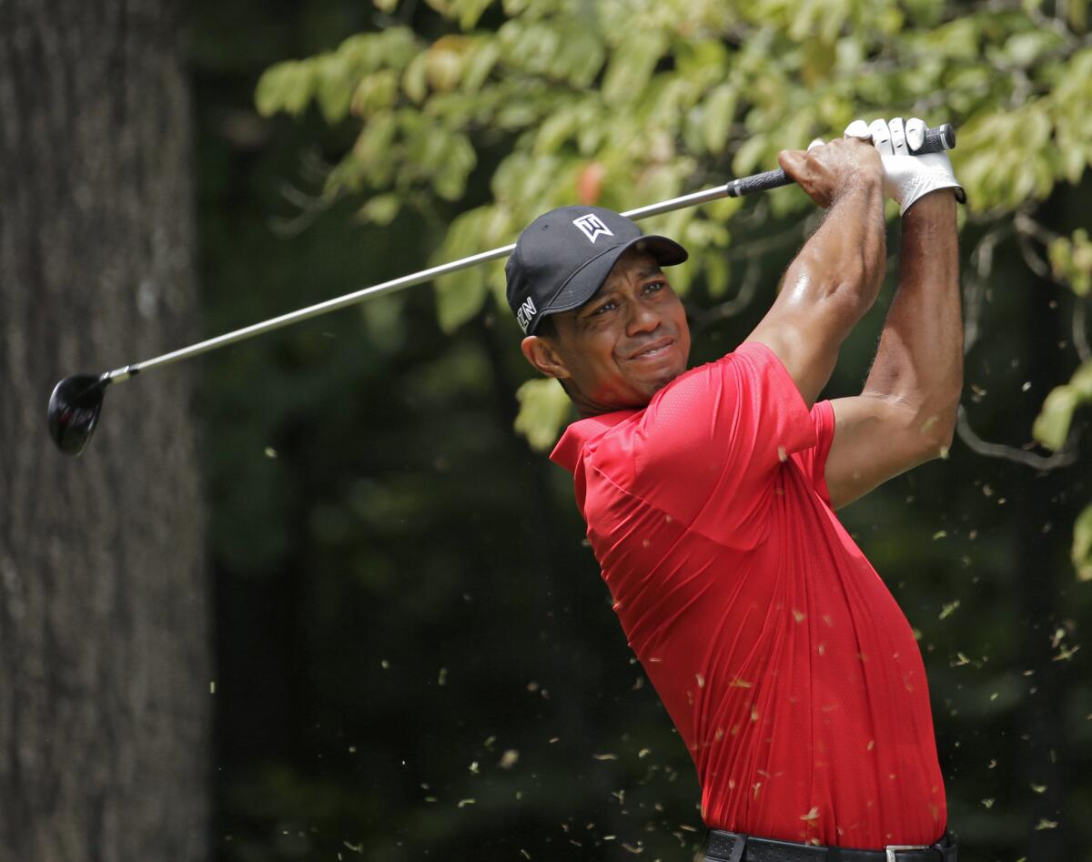 Tiger Woods watches his tee shot on the second hole at the Wyndham Championship on Aug. 23, 2015, in Greensboro, N.C.