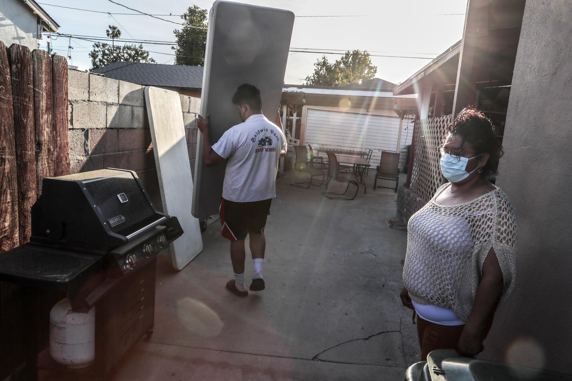 Cesar Martinez helps his mother, Maria Elena Martinez, with her business, often delivering party supplies.