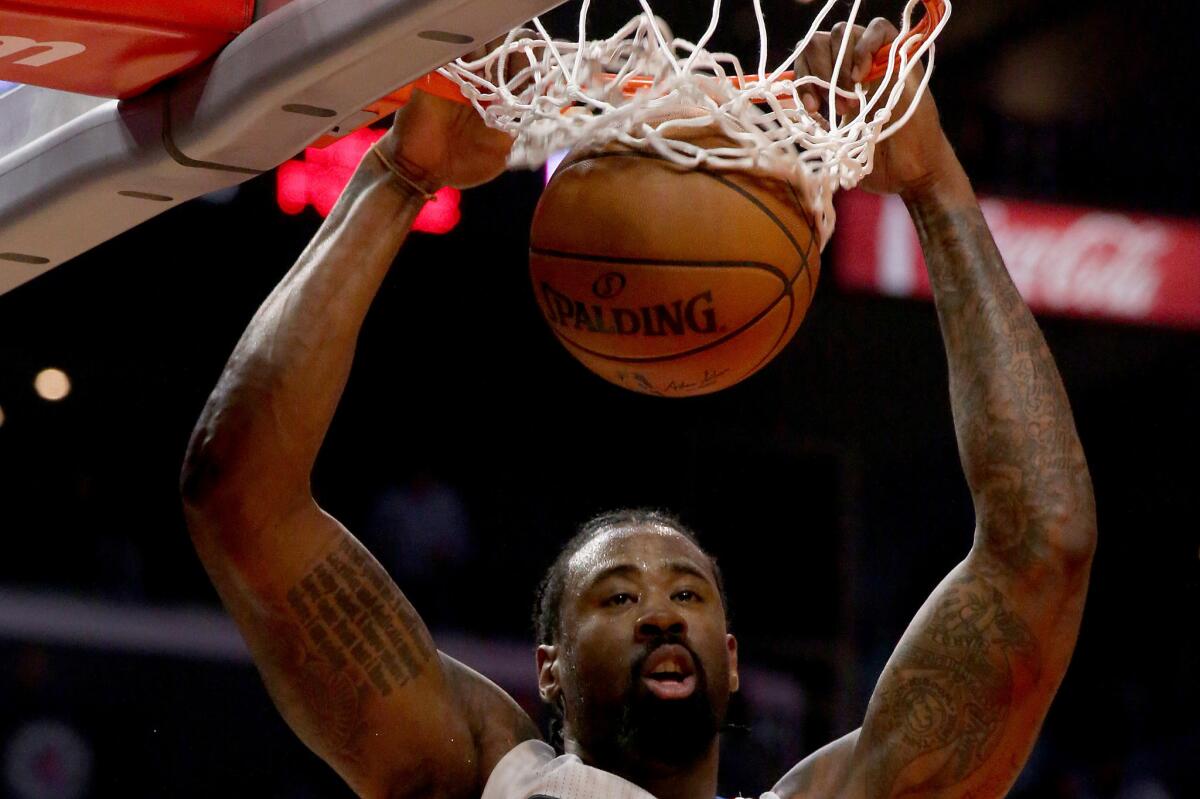 Clippers center DeAndre Jordan puts down a dunk against the Lakers during the first half.