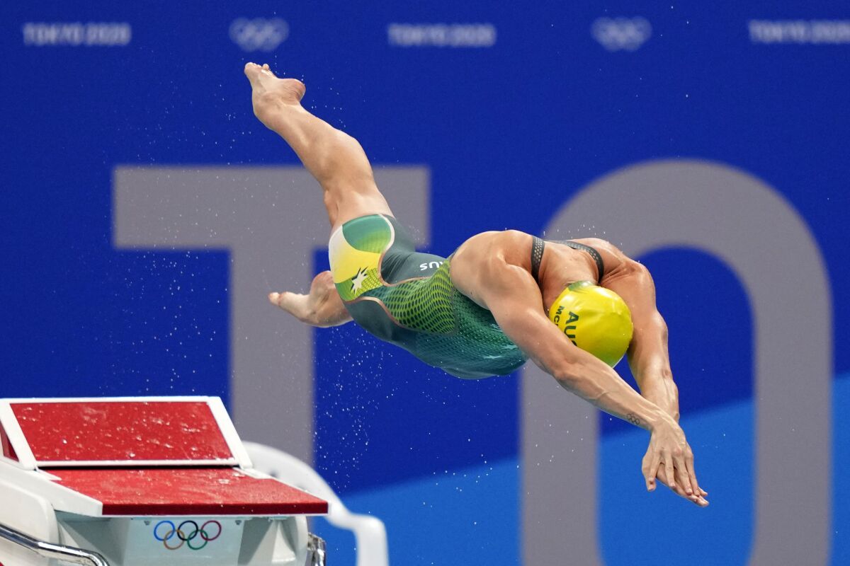 Emma Mckeon, of Australia, dives off the starting block in the women's 50-meter freestyle final at the 2020 Summer Olympics, Sunday, Aug. 1, 2021, in Tokyo, Japan. (AP Photo/David Goldman)