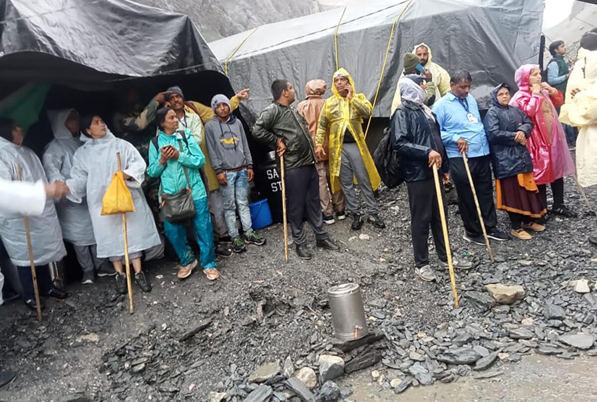 Hindu devotees are seen stranded after a cloudburst near the base camp of the holy cave shrine of Amarnath in south of Kashmir Himalayas, in India, Friday, July 8, 2022. A cloudburst hit near the base camp of the holy cave shrine of Amarnath in south Kashmir Himalayas on Friday, many have lost their lives and more than 40 are feared missing, according to the officials. (Jammu and Kashmir Government's Department of Disaster Management via AP)