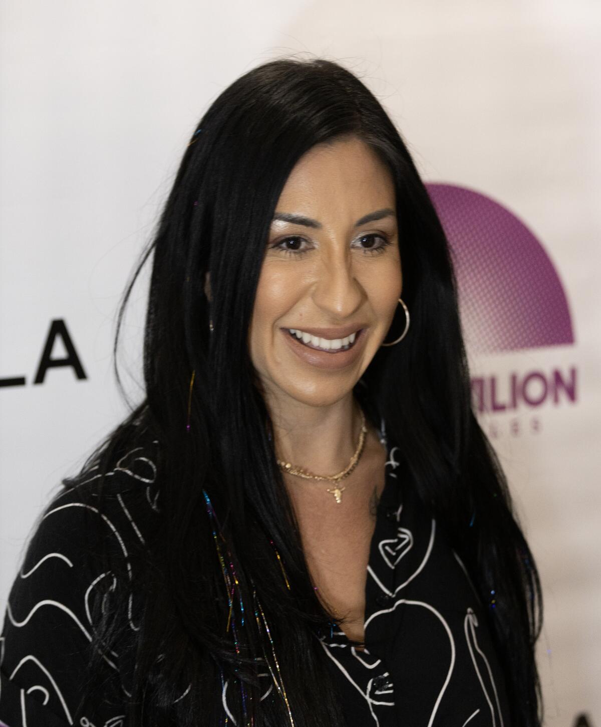 Beatriz Solis poses for the media during a lineup announcement to promote the Levitt Pavilion Summer Concert Series.