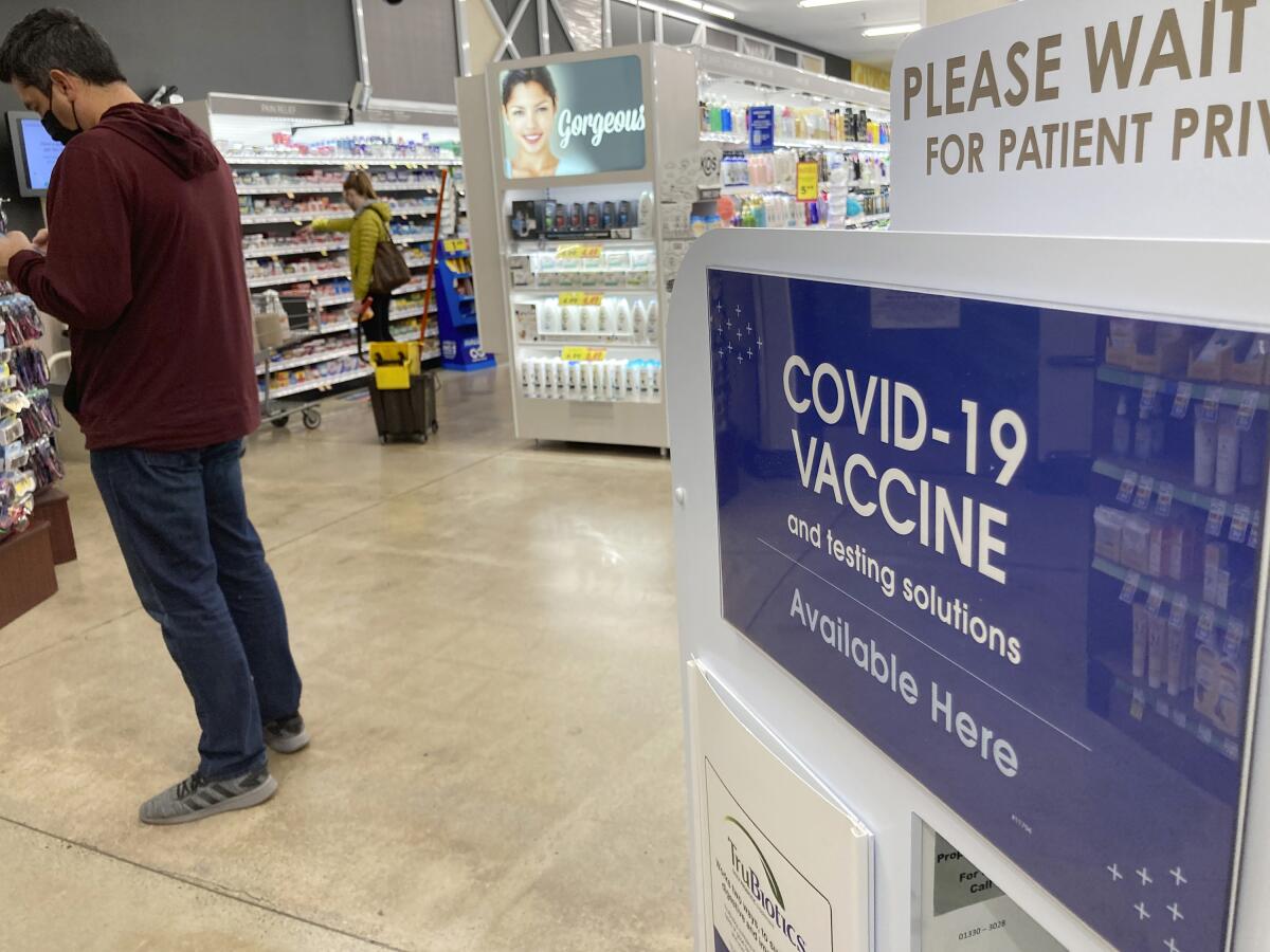 A man waits for a COVID-19 booster shot in Denver