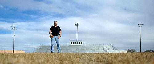 FIELD GENERAL: Sterling High football Coach Mark Bauder at the school's stadium.