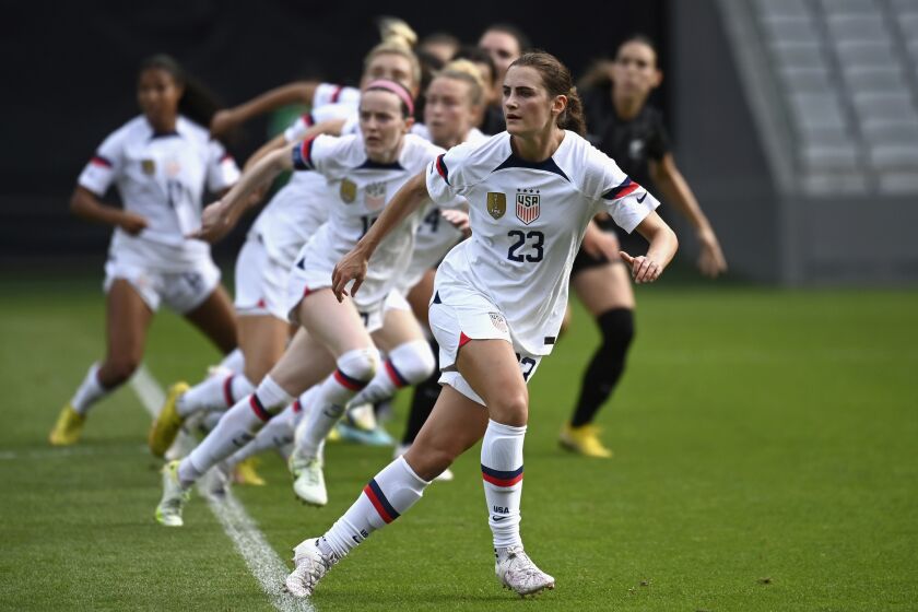 Emily Fox of the U.S., center, leads a string of teammates against New Zealand during their women's international soccer friendly game in Auckland, New Zealand, Saturday, Jan. 21, 2023. (Andrew Cornaga/Photosport via AP)