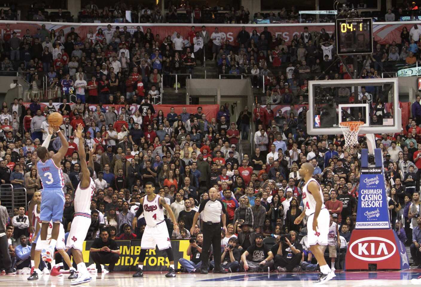 Clippers point guard Chris Paul attempts a tying three-point shot against the Spurs in the final seconds of overtime on Saturday afternoon at Staples Center. Paul's shot missed and San Antonio collected a 103-100 victory.