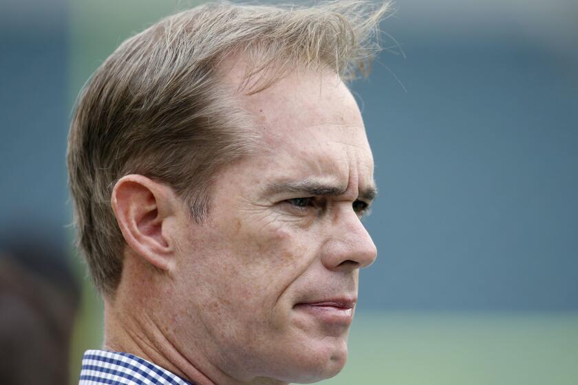 Sportscaster Joe Buck watches pre-game warmups before an NFL football game between the Philadelphia Eagles and the Washington Redskins, Sunday, Sept. 21, 2014, in Philadelphia. (AP Photo/Michael Perez)