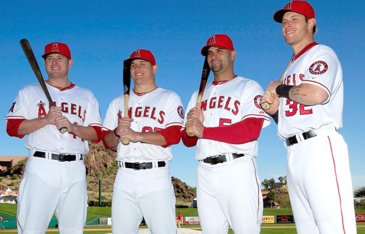 The Angels offense will count on the big bats of (from left) Mark Trumbo, Mike Trout, Albert Pujols and Josh Hamilton this season.