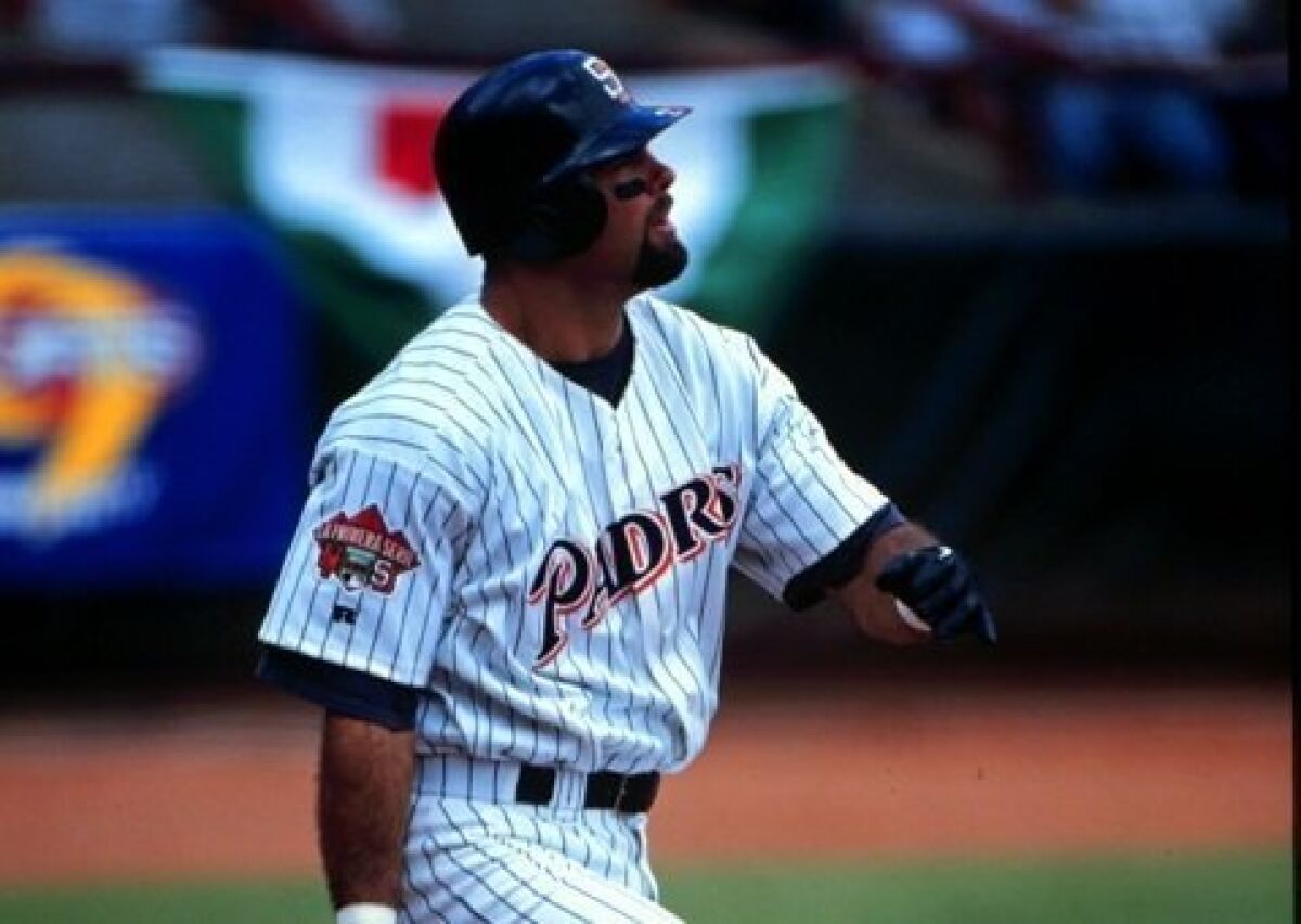 Ken Caminiti hits a home run in Mexico in 1996.