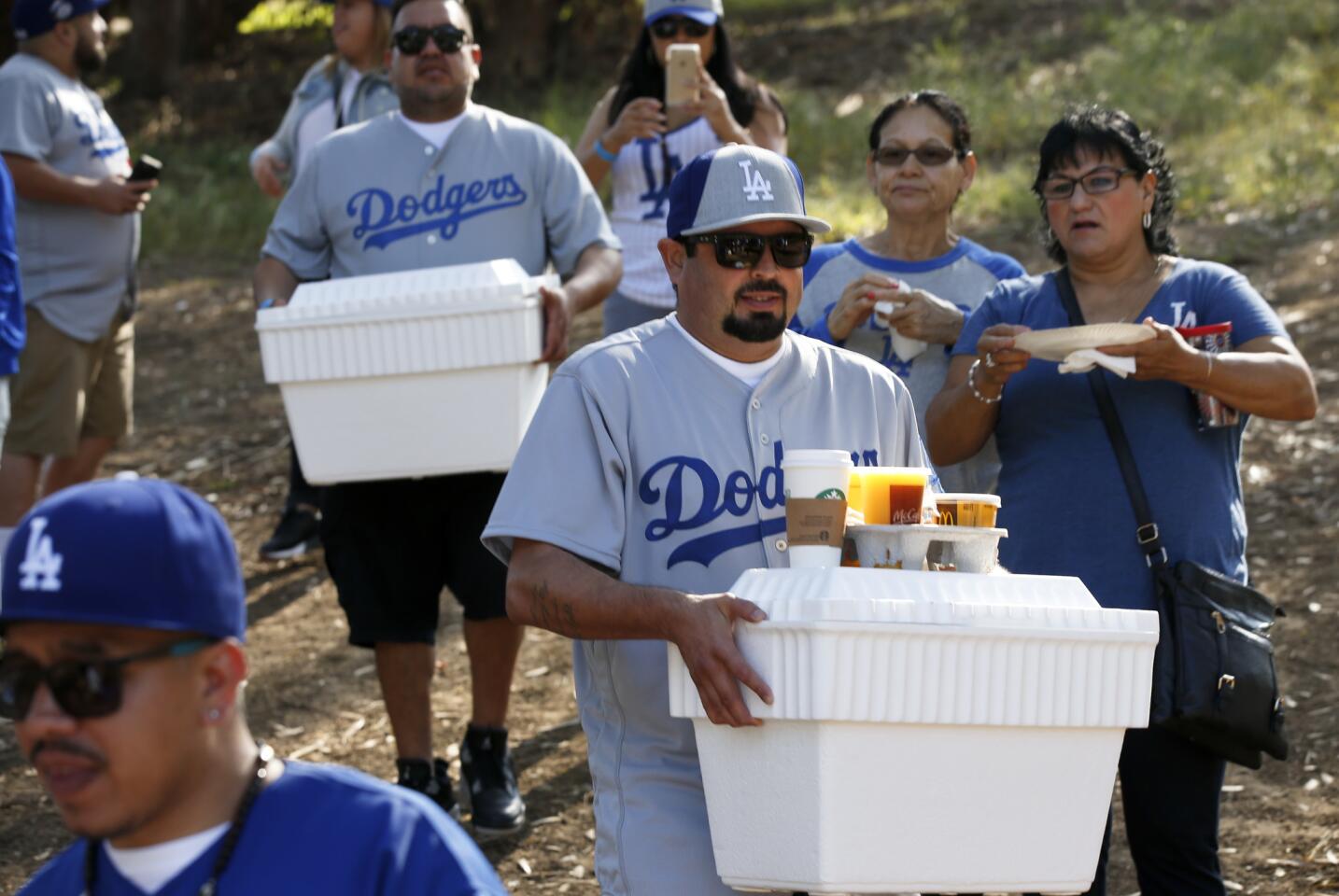 LOS ANGELES, CA., APRIL; 12, 2016: The food is still arriving at the opening day Dodger celebrations in Elysian Park, where live bands, barbecues and fun are all bundled together like tailgate parties used to be April 12, 2016 (Mark Boster / Los Angeles Times ).