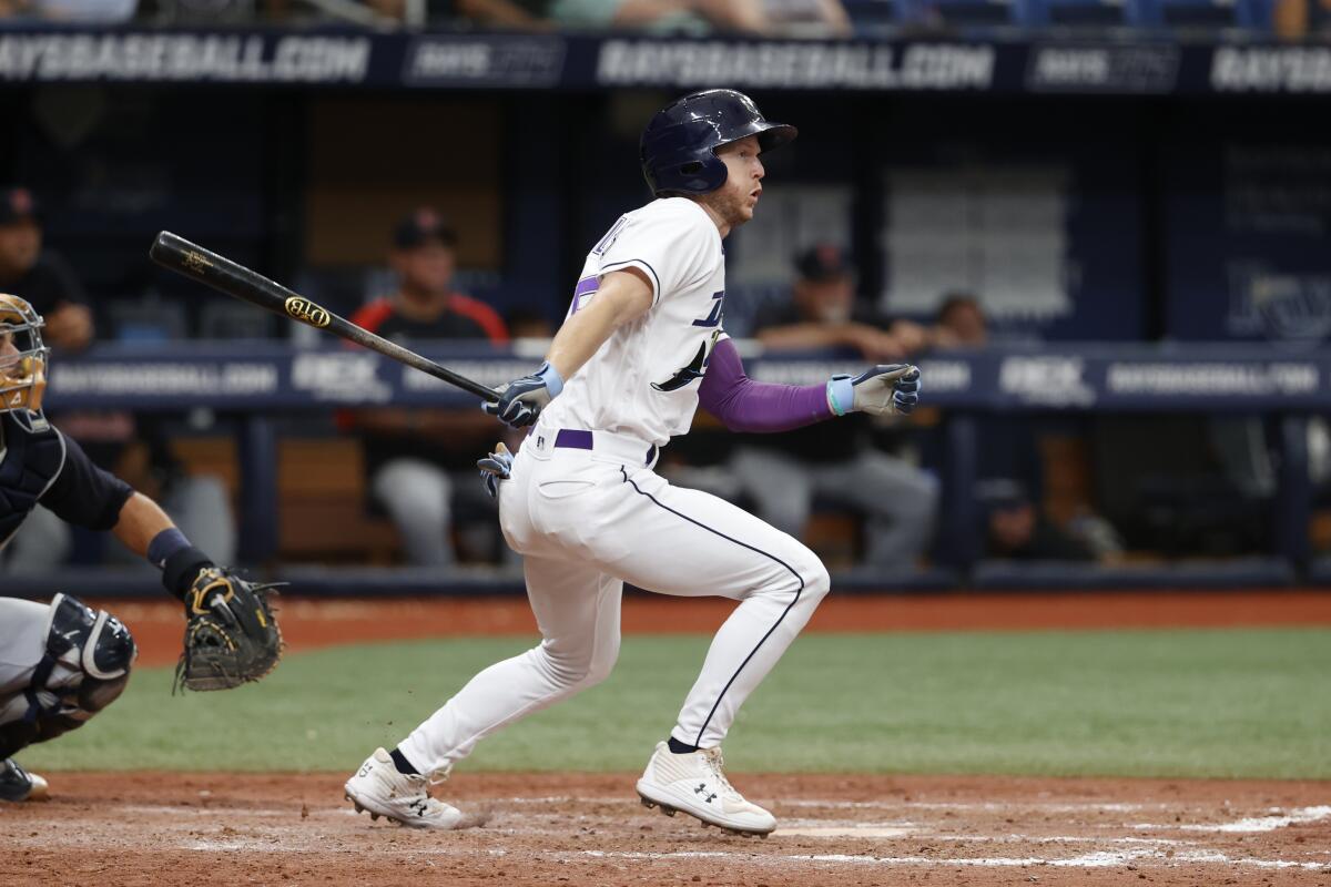 Tampa Bay Rays' Brett Phillips hits an RBI single to right during the eighth inning of a baseball game against the Cleveland Guardians, Saturday, July 30, 2022, in St. Petersburg, Fla. (AP Photo/Scott Audette)