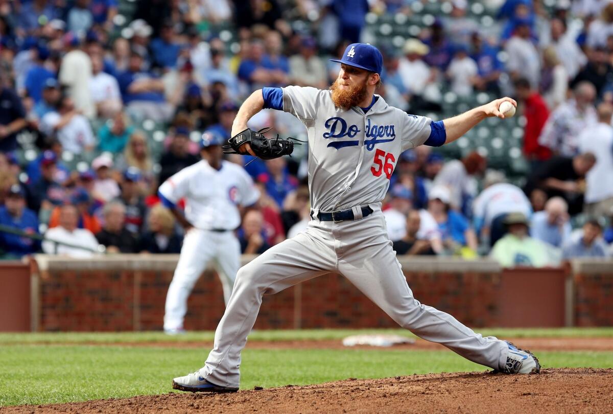 Reliever J.P. Howell gave up four earned runs in the seventh inning of the Dodgers' 8-7 loss Saturday to the Cubs at Wrigley Field.