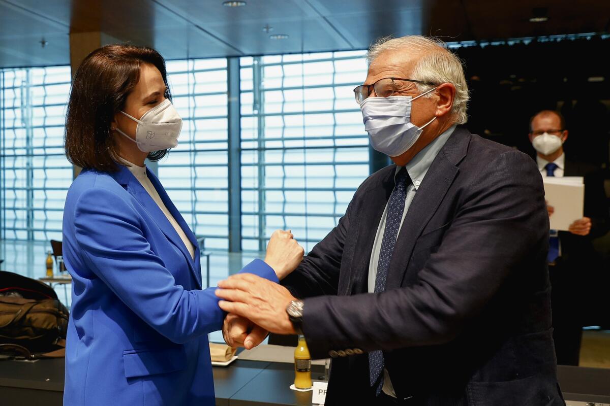 European Union foreign policy chief Josep Borrell, right, greets Belarusian opposition politician Sviatlana Tsikhanouskaya 