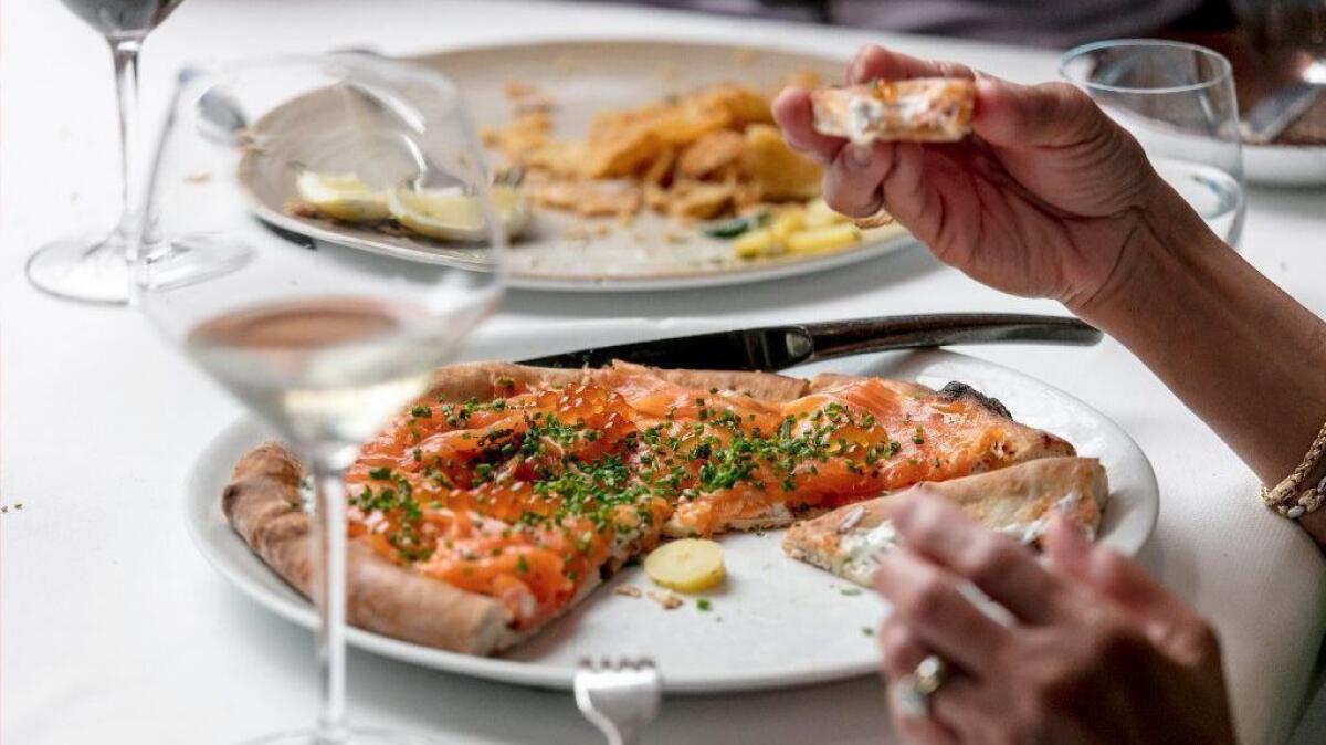 One of Spago's iconic dishes is pizza with house-cured smoked salmon; it isn't listed on the menu at dinner but is easily requested.