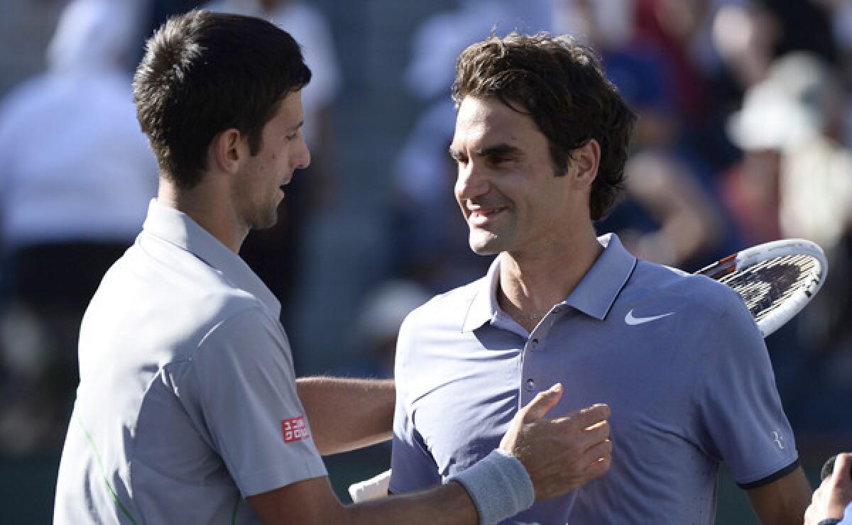 Novak Djokovic, left, is congratulated by Roger Federer after Djokovic's victory in the BNP Paribas Open final at Indian Wells on Sunday.