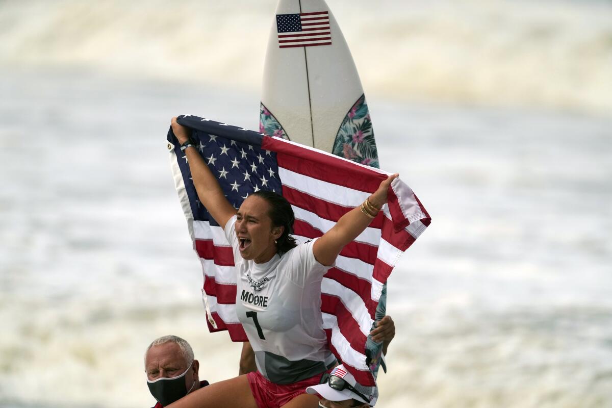 U.S. surfer Carissa Moore celebrates after winning the gold medal on Tuesday.