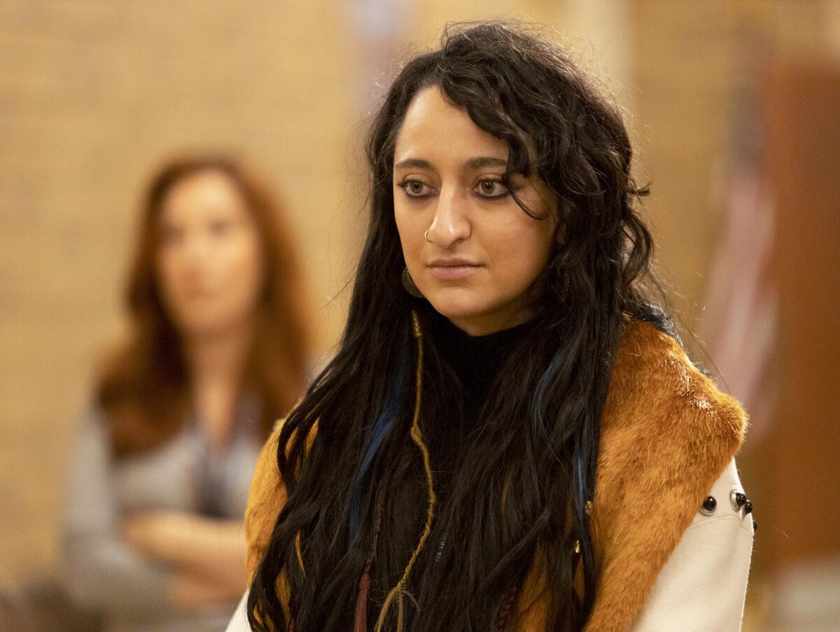 A woman with llong dark hair.