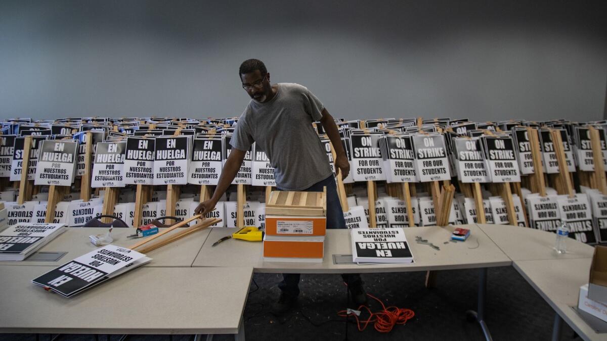 Print assistant Chris Dockens is in the process of making 10,000 strike posters as the LAUSD teachers strike looms.