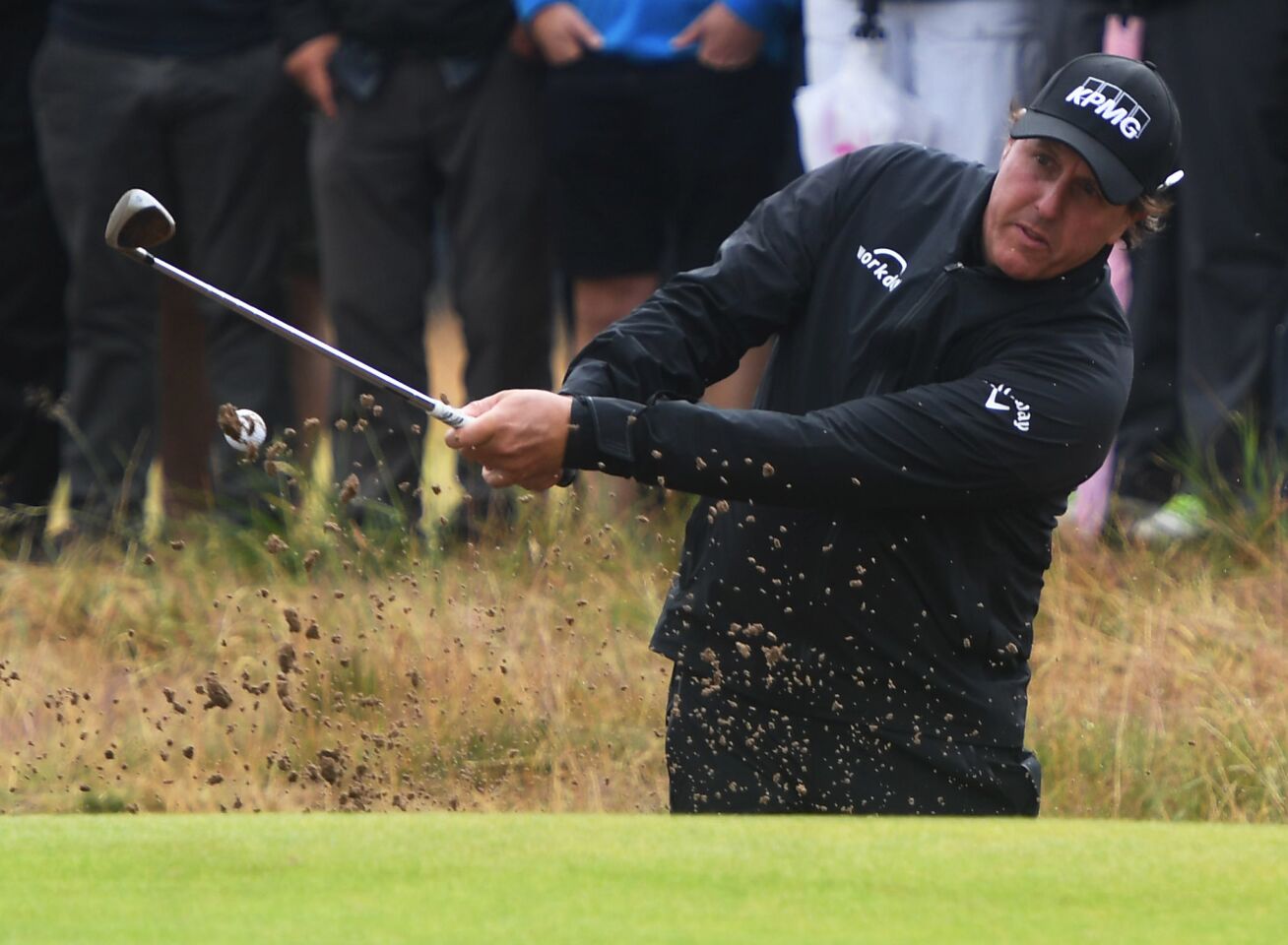 Phil Mickelson blasts out of a fairway bunker during the second round of the Britsh Open.