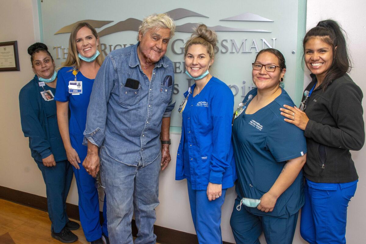 Jay Leno pictured with several employees of the Grossman Burn Center in West Hills