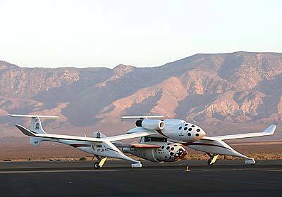 SpaceShipOne attached to White Knight taxis on the way to the runway for take off at Mojave Airport.