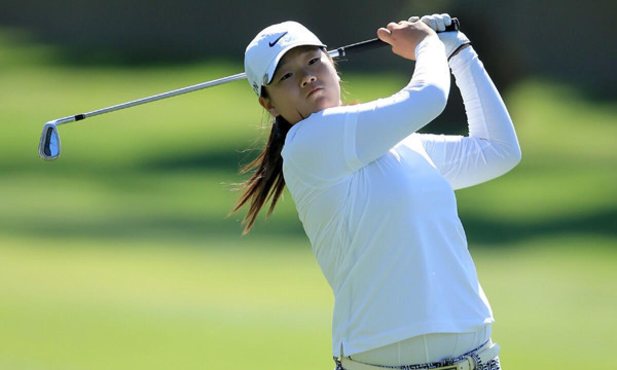 Amateur Angel Yin hits her second shot on the 15th hole during the first round of the Kraft Nabisco Championship at Mission Hills Country Club in Rancho Mirage on Thursday.