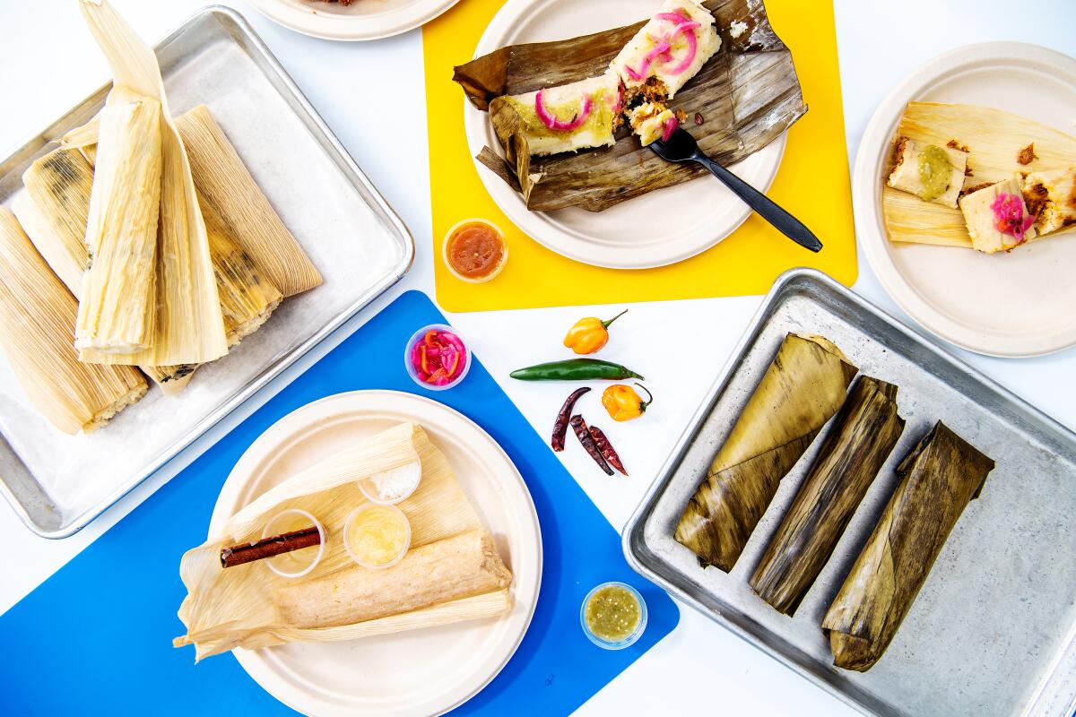 (Clockwise from top): The pibil, braised pork, pineapple, and stacks of other tamales from Artesano Tamaleria.