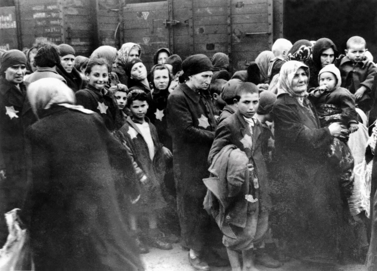 Prisoners at the Nazi death camp in Auschwitz, Poland, in a 1944 photo. An 89-year-old former guard at the camp died in Philadelphia on Tuesday hours before a judge ordered his extradition to Germany to face war crime charges.