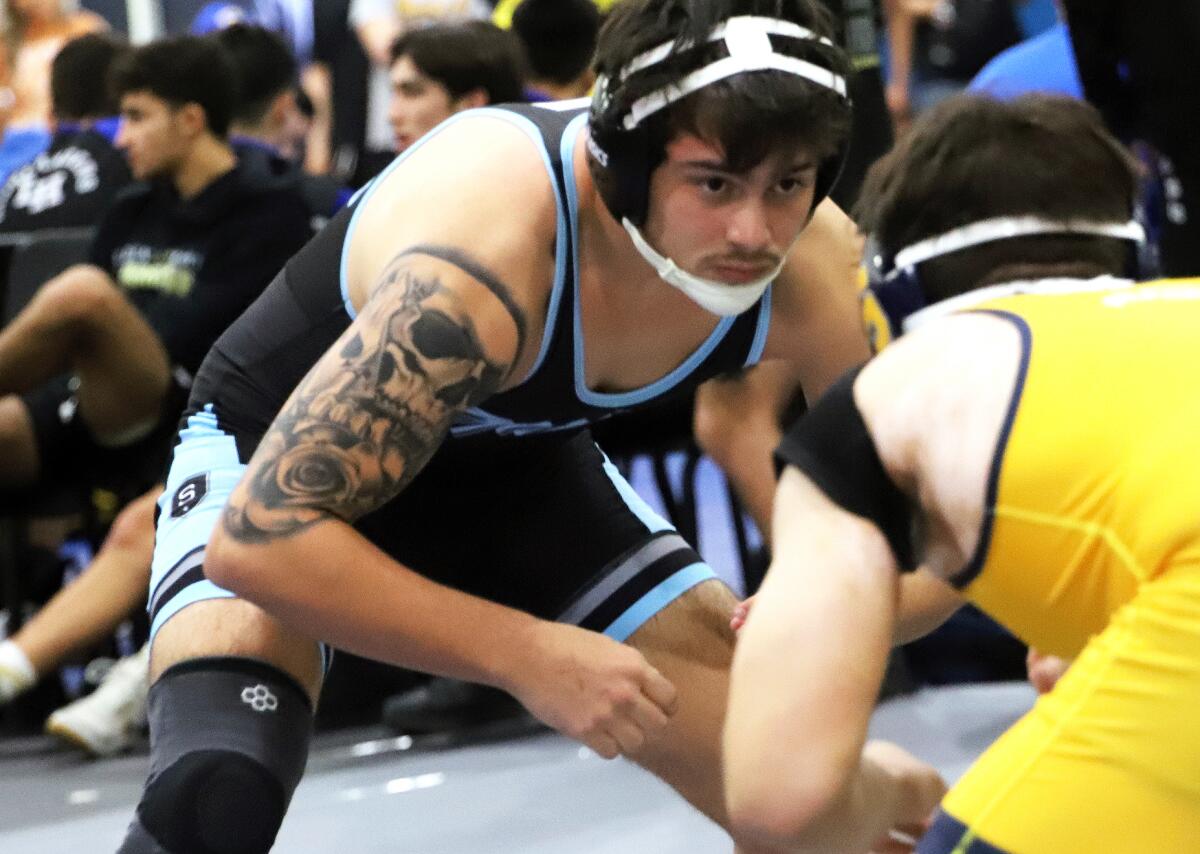 Marina's Alex Miramontes wrestles against Sonora in the 160-pound match in the CIF dual meet wrestling championships.