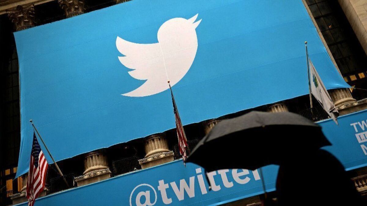 A banner with the Twitter logo on the front of the New York Stock Exchange in 2013.