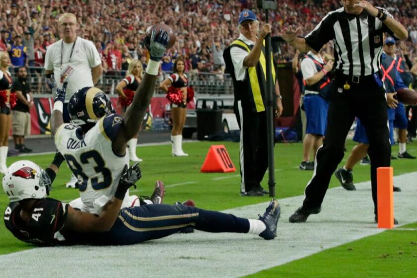 Rams receiver Brian Quick holds up the ball after catching a four-yard touchdown pass against the Cardinals on Oct. 2.