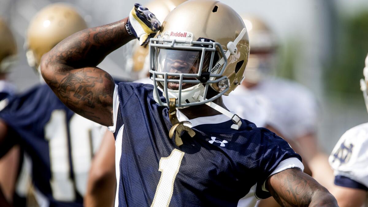 Greg Bryant salutes a teammate during a Notre Dame practice in 2014.
