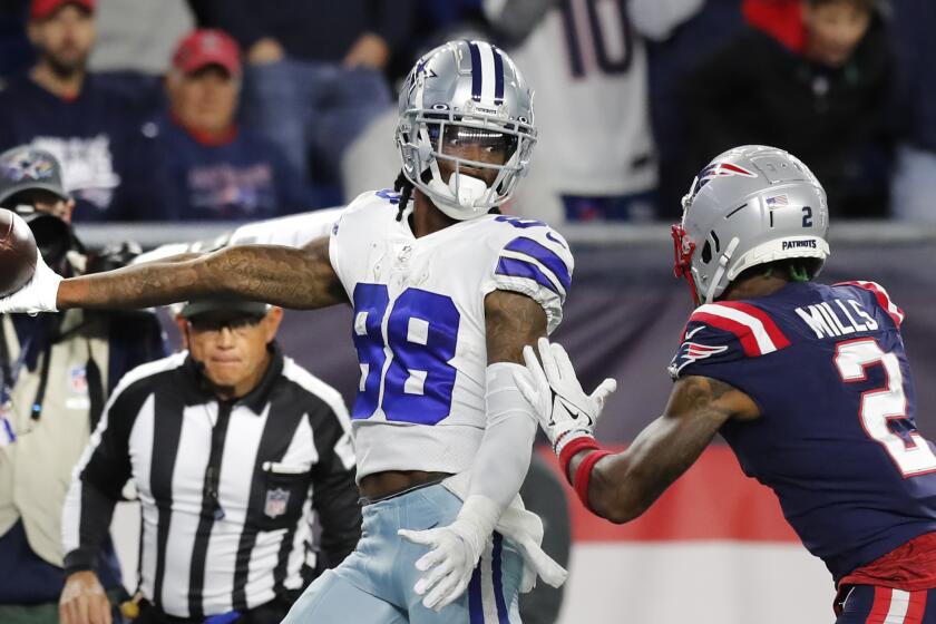 Dallas Cowboys wide receiver CeeDee Lamb (88) stretches the ball over the goal line.