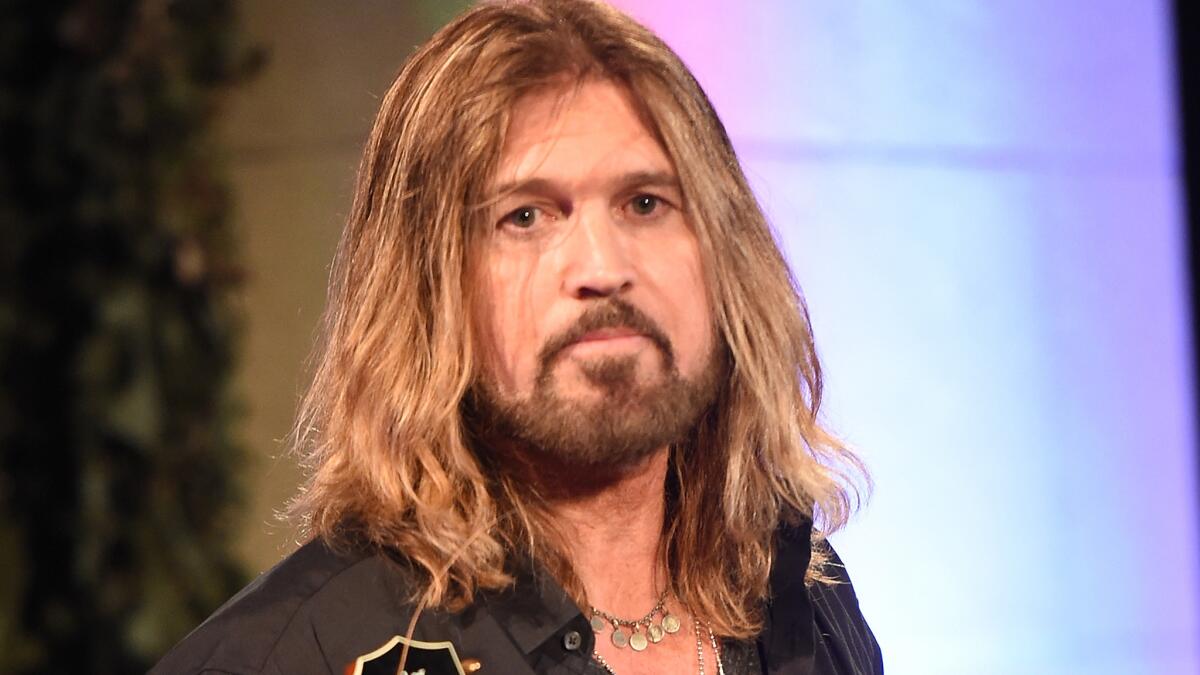 Billy Ray Cyrus appears to have Patrick Schwarzenegger's back after his daughter Miley Cyrus' boyfriend ran into some public embarrassment over vacation photos.