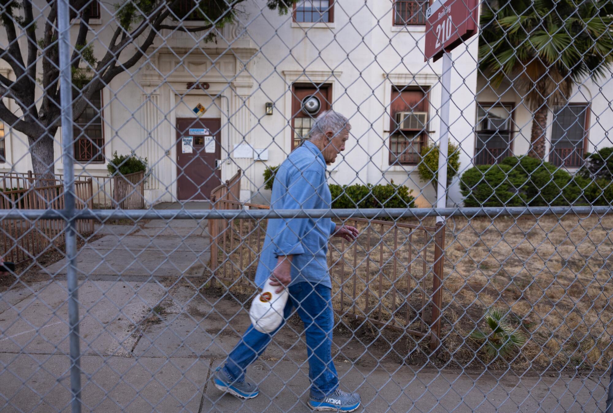 U.S. District Judge David O. Carter walks on a tour of the VA's West L.A. facilities.