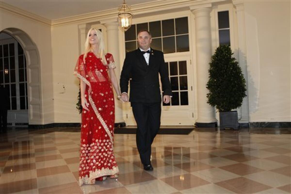 In this Tuesday, Nov. 24, 2009 photo, Michaele and Tareq Salahi, right, arrive at a state dinner hosted by President Barack Obama for Indian Prime Minister Manmohan Singh at the White House in Washington. The Secret Service is looking into its own security procedures after determining that the Virginia couple managed to slip into Tuesday night's state dinner at the White House even though they were not on the guest list, agency spokesman Ed Donovan said. (AP Photo/Gerald Herbert)