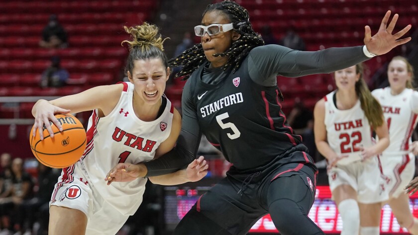 Stanford forward Francesca Belibi (5) defends against Utah guard Isabel Palmer (1) in the second half during an NCAA college basketball game Sunday, Jan. 16, 2022, in Salt Lake City. (AP Photo/Rick Bowmer)