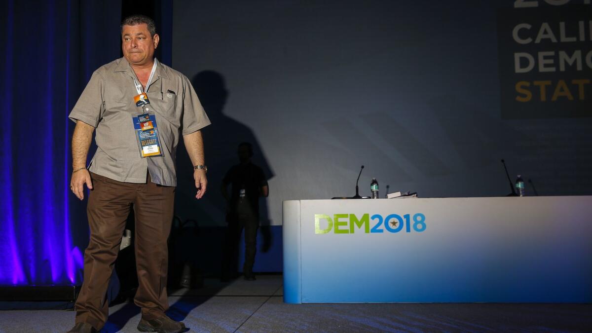 Eric Bauman, who announced his resignation Thursday as chairman of the California Democratic Party, takes the stage at the state party convention in Sacramento on May 21, 2017.