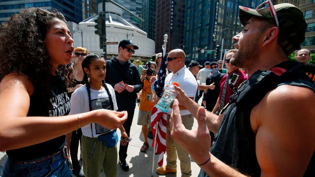 A Muslim supporter, left, argues with a demonstrator at the March Against Sharia protest in Chicago on Saturday.