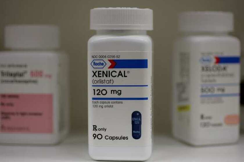 A bottle of Xenical, a weight-loss aid made by GlaxoSmithKline. The company is making a hostile bid for Human Genome Sciences.