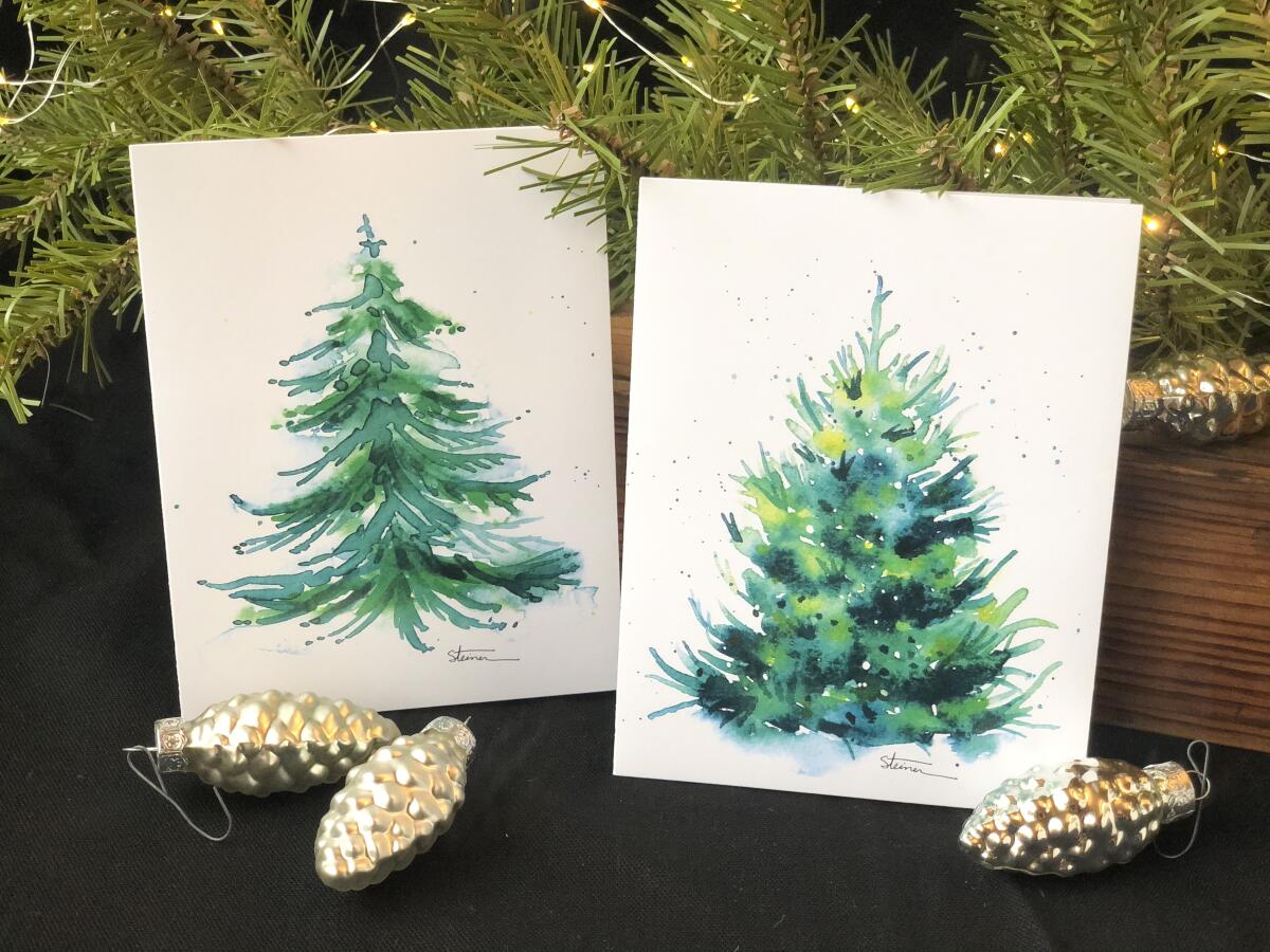 Esta imagen proporcionada por Judy A. Steiner muestra tarjetas navideñas hechas a mano con acuarela.